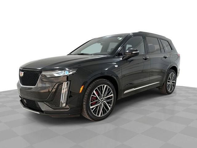 2025 Cadillac XT6 Sport in Stellar Black Metallic — front three-quarter view